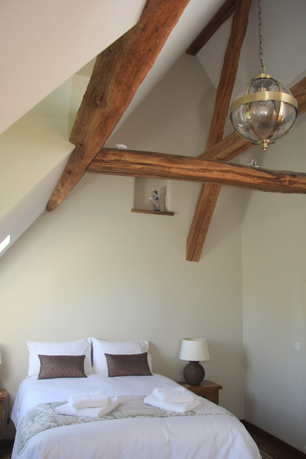 Orchard bedroom exposed beams