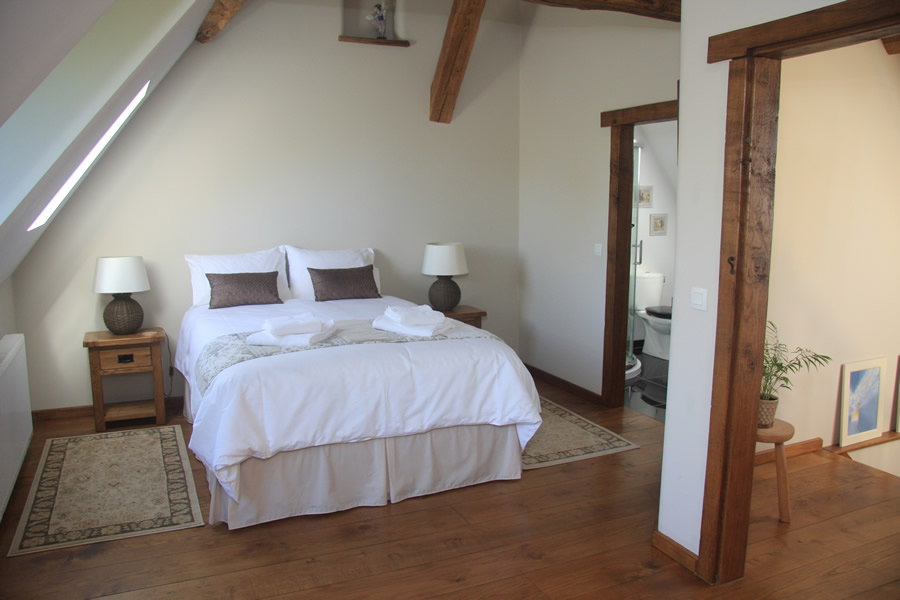 Orchard bedroom bed and garden view